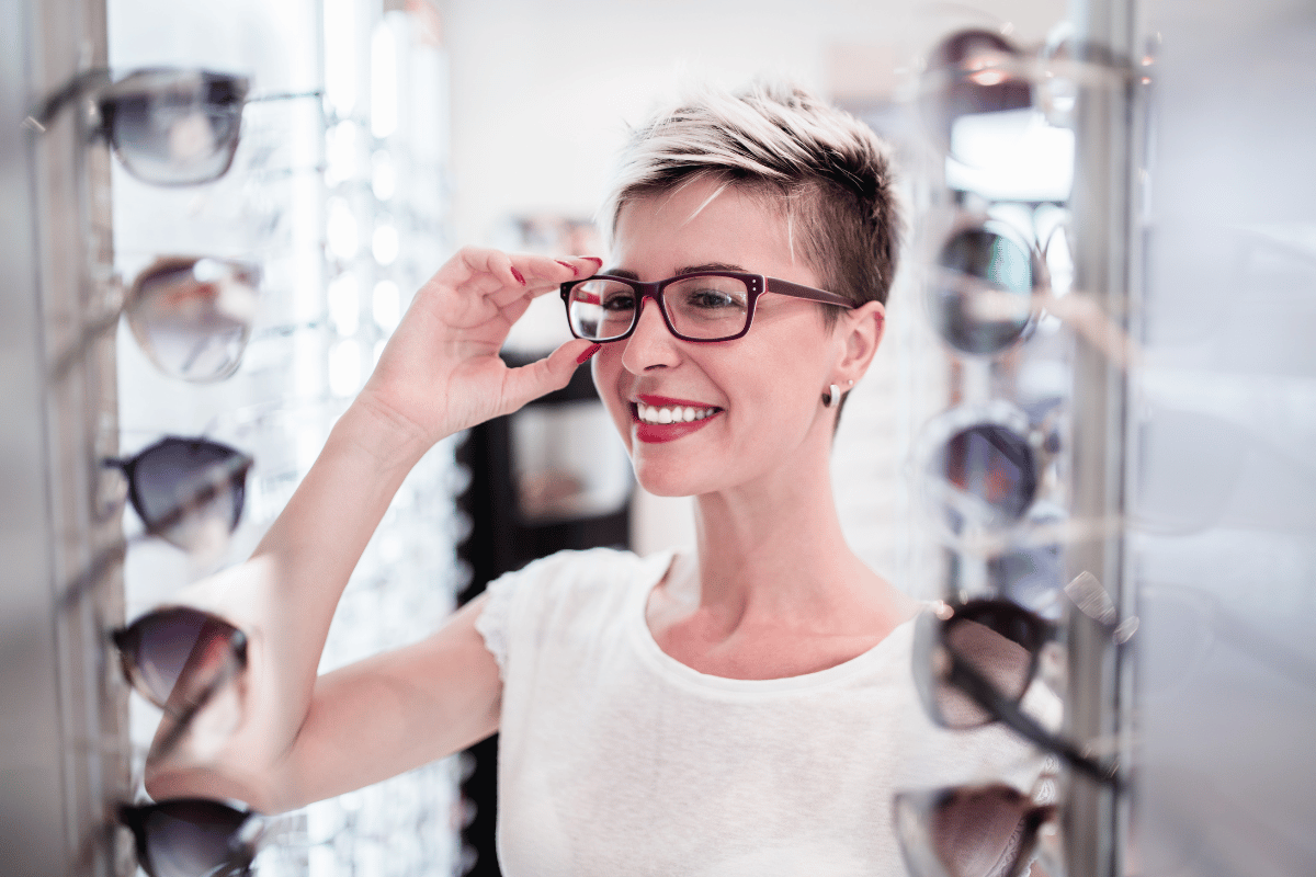 woman trying on eyewear in optical